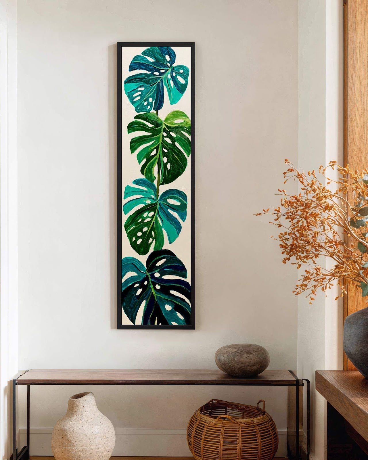 Vertical canvas wall art in interior setting.