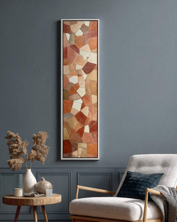 Vertical canvas wall art in interior setting.