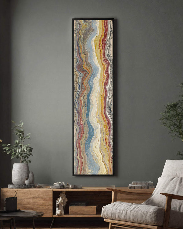 Vertical canvas wall art in interior setting.