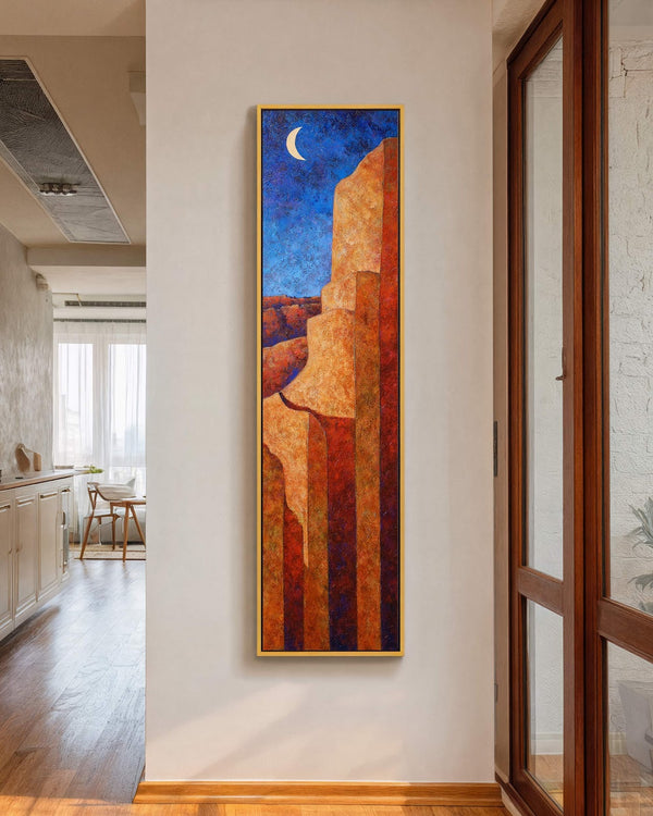 Vertical canvas wall art in interior setting.