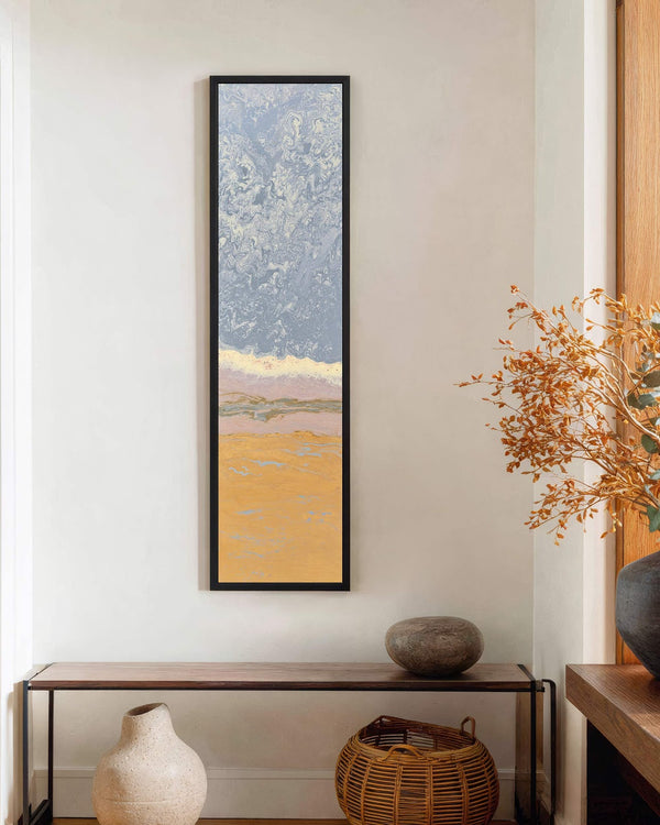 Vertical canvas wall art in interior setting.