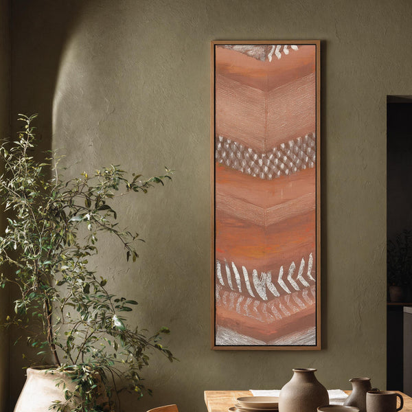 Vertical canvas wall art in interior setting.