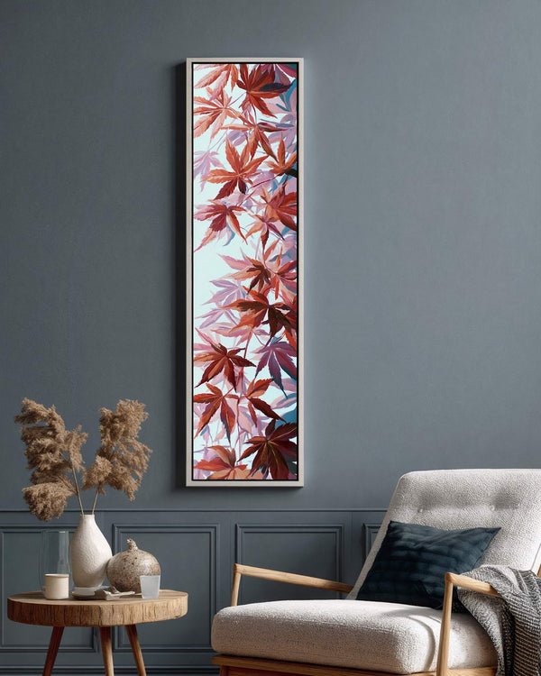 Vertical canvas wall art in interior setting.