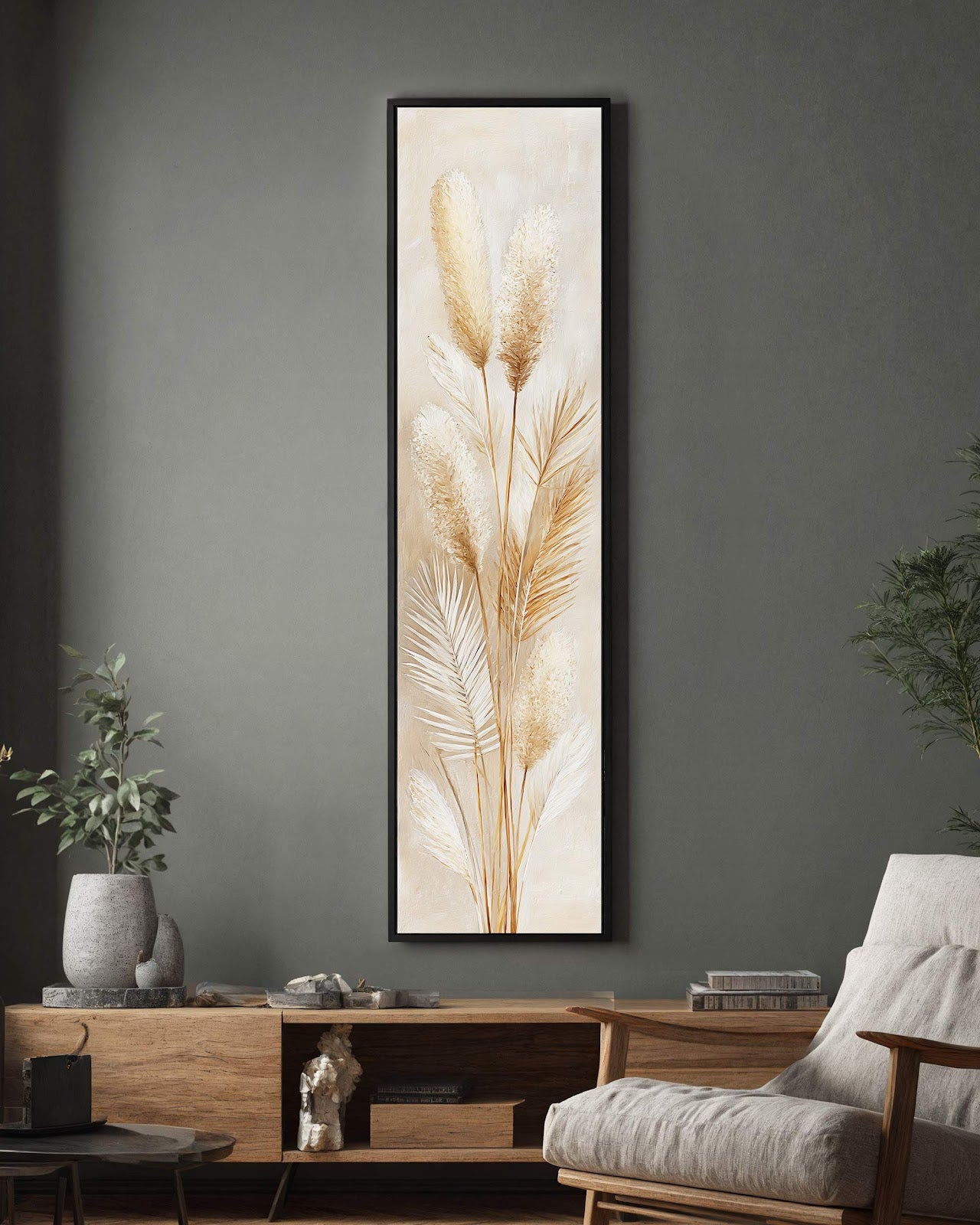 This vertical canvas wall art showcases textured pampas grass in a neutral palette and black floater frame, hanging on a gray wall above a wooden console in a living room.