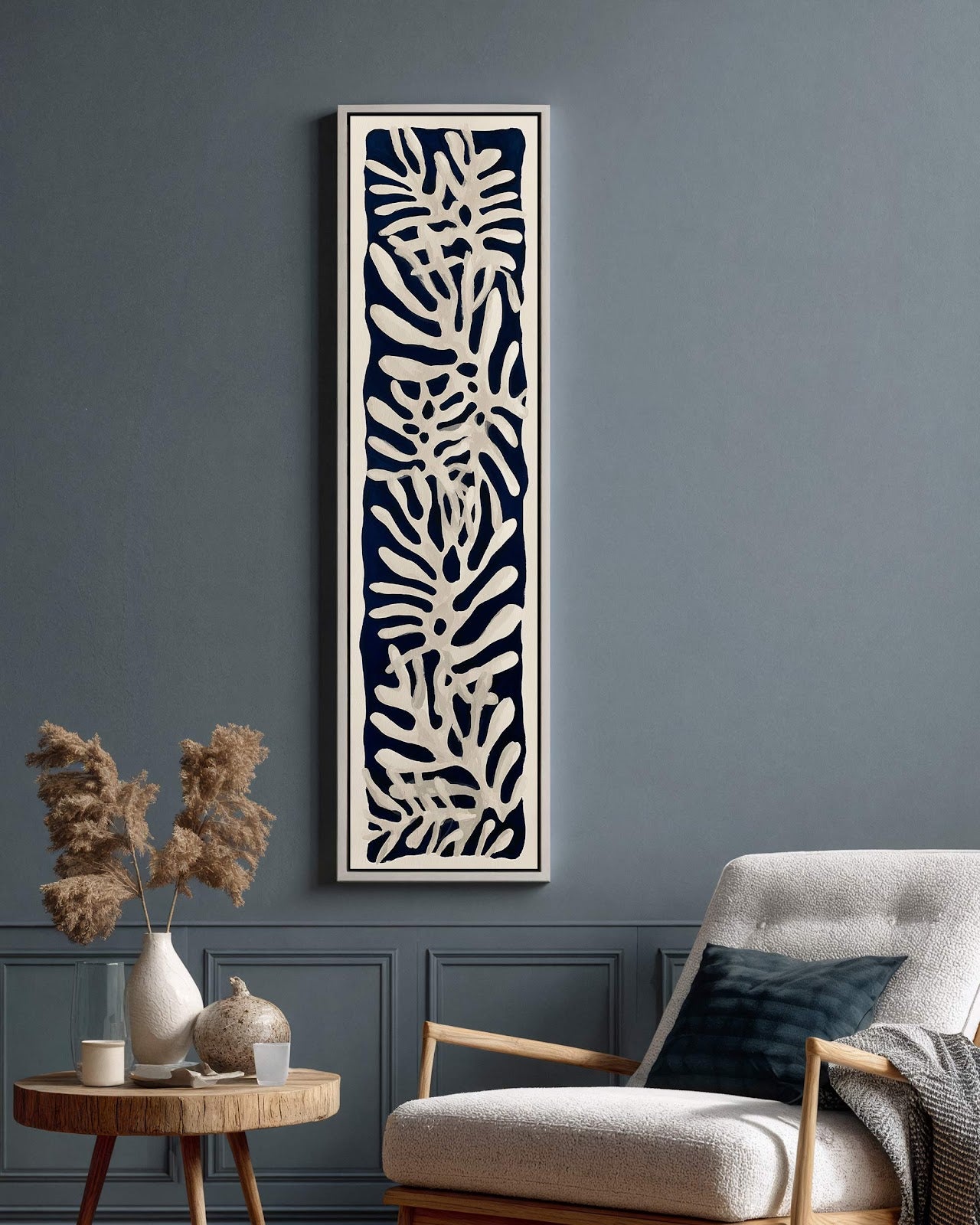 Vertical canvas wall art in interior setting.