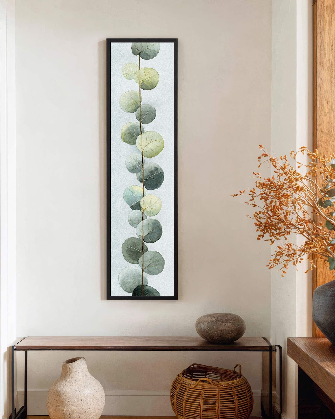 Vertical canvas wall art in interior setting.