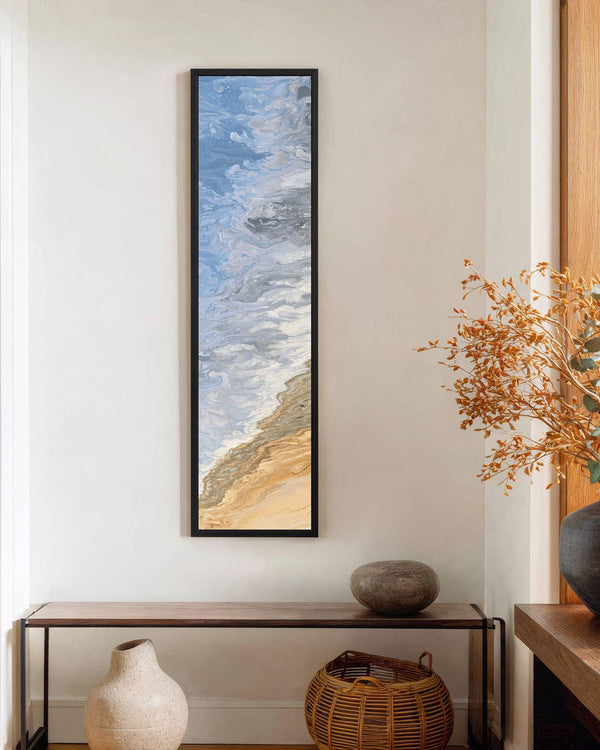 Vertical canvas wall art in interior setting.