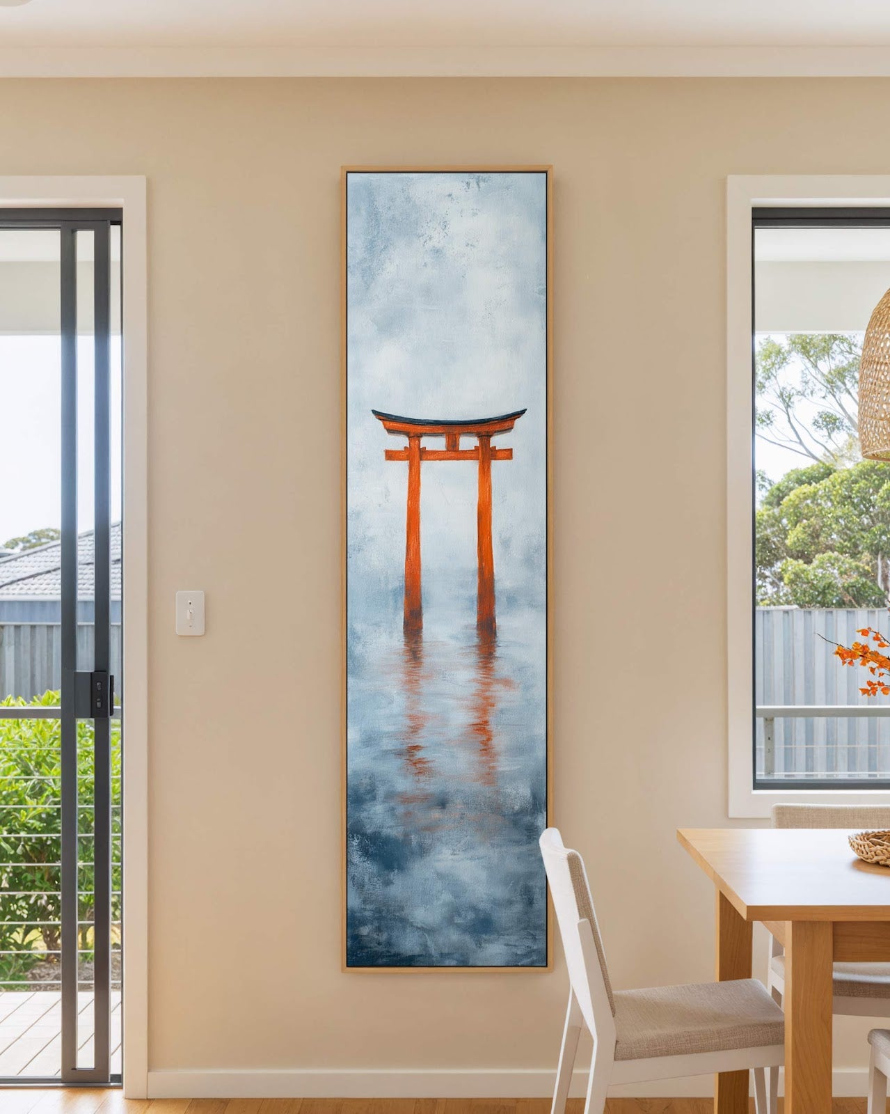 Vertical canvas wall art in interior setting.