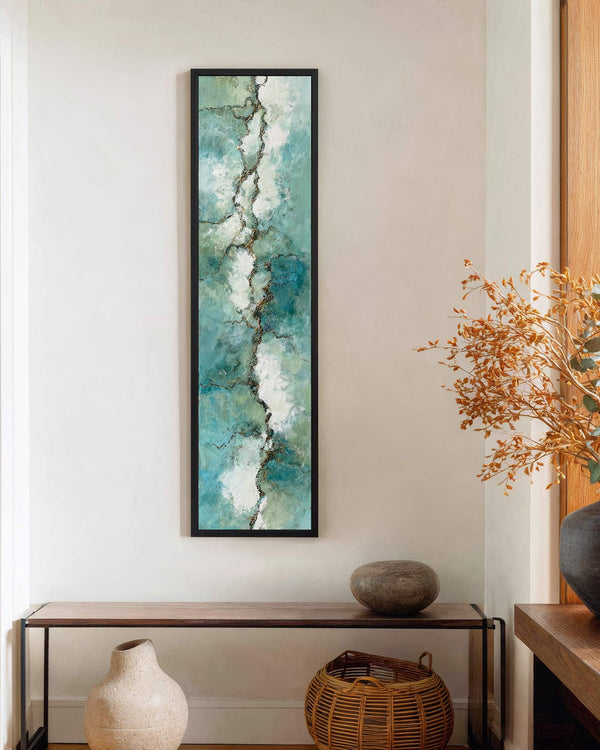 Vertical canvas wall art in interior setting.