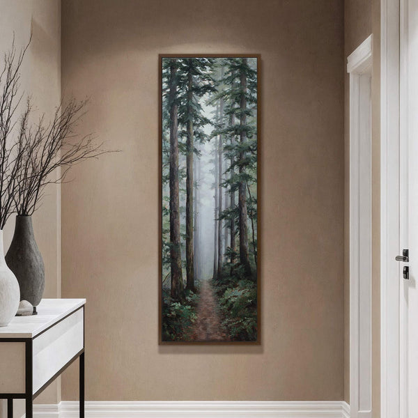 This vertical canvas wall art features a painterly depiction of a misty forest path with tall evergreen trees, rendered in a realistic style with a muted green and brown palette.
