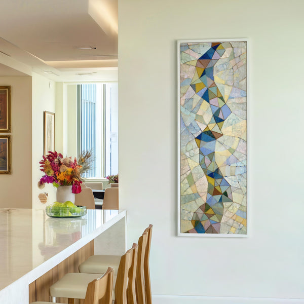 Vertical canvas wall art in interior setting.