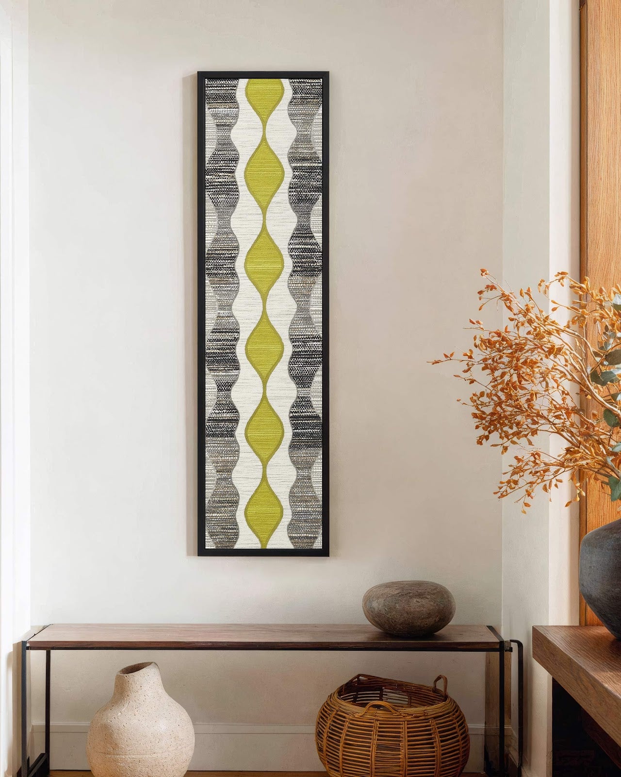 Vertical canvas wall art in interior setting.