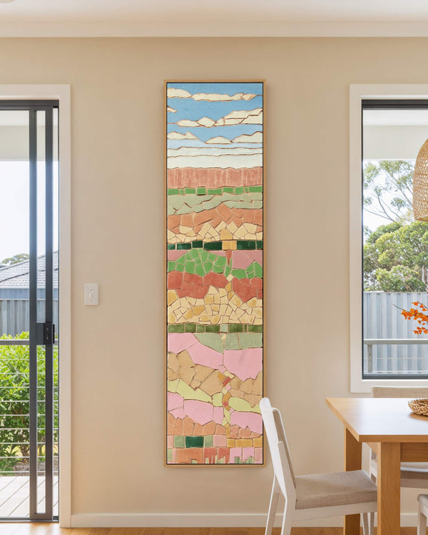 Vertical canvas wall art in interior setting.