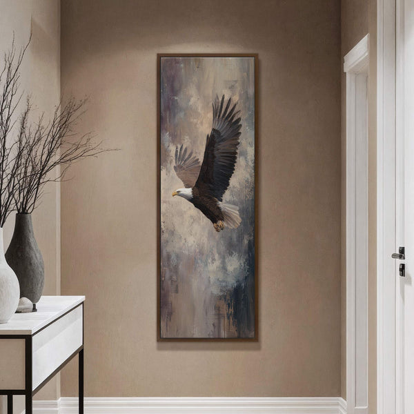This vertical canvas wall art features a realistic painting of a bald eagle in flight, with a muted palette of grays, browns, and whites, set against an abstract, textured background.