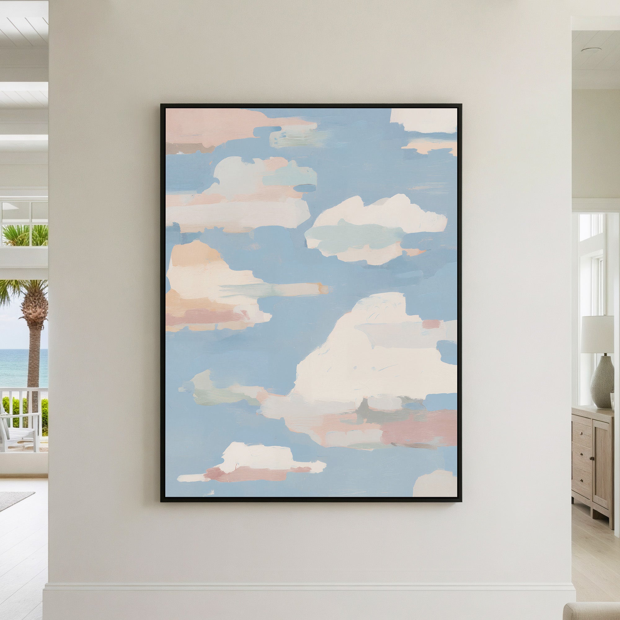 Large abstract cloud painting with soft pink, peach, sage green and cream clouds drifting across a pale blue sky, featuring visible brushstrokes perfect for statement wall decor