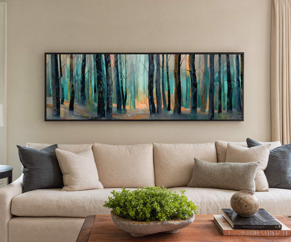 Emerald Silence framed forest landscape canvas wall art displayed above a beige sofa in a modern living room with neutral decor