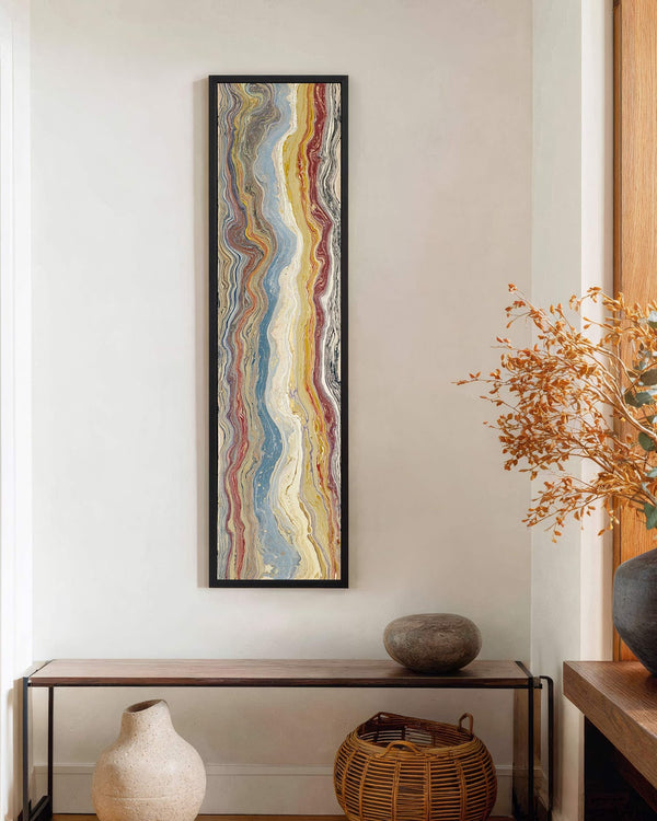 Vertical canvas wall art in interior setting.