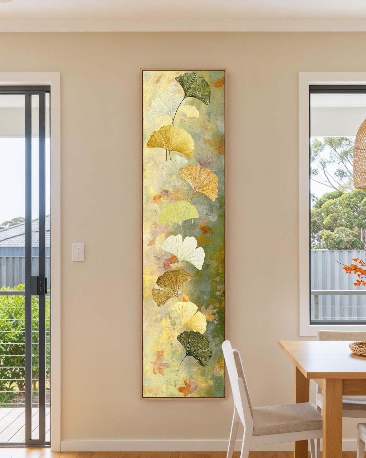 Vertical canvas wall art in interior setting.