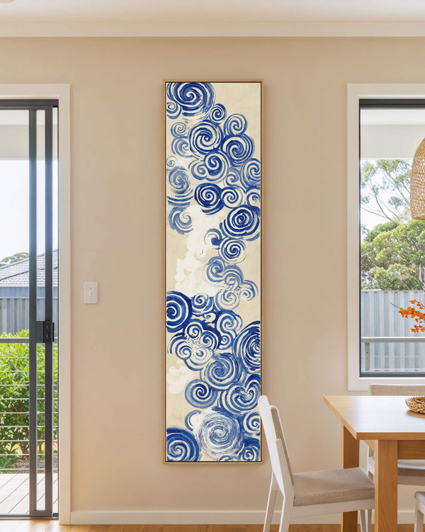 Vertical canvas wall art in interior setting.