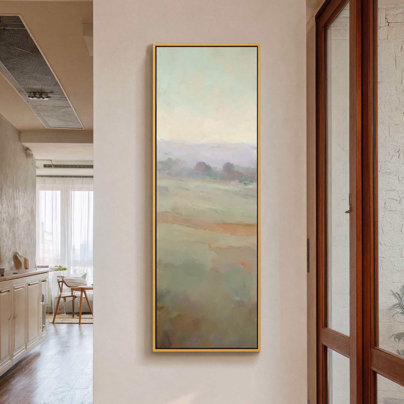 This abstract landscape art print features a serene palette of greens and blues, with soft, hazy forms suggesting trees and fields. The vertical canvas wall art is framed in a.