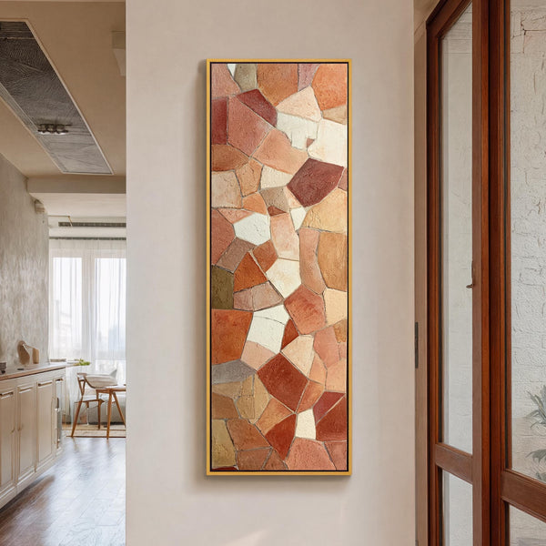 Vertical canvas wall art in interior setting.