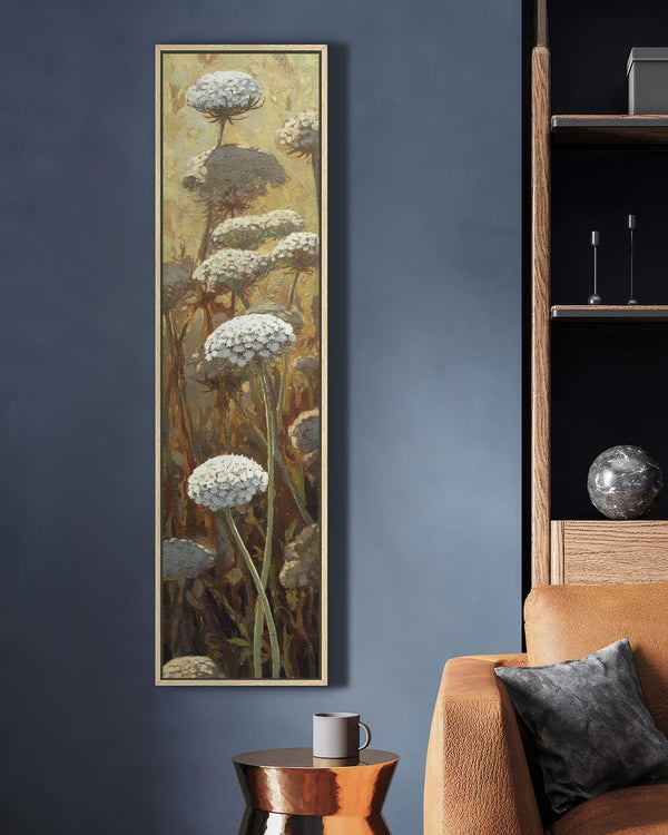 Vertical canvas wall art in interior setting.