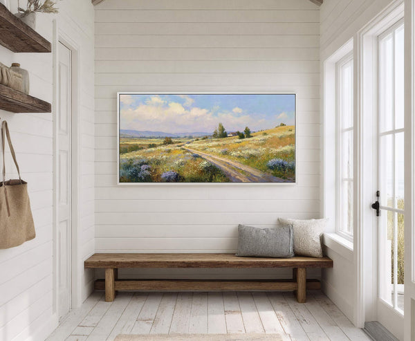 This horizontal canvas wall art depicts a pastoral landscape with a dirt path winding through a field of wildflowers, rendered in a loose, impressionistic style with a bright palette of.