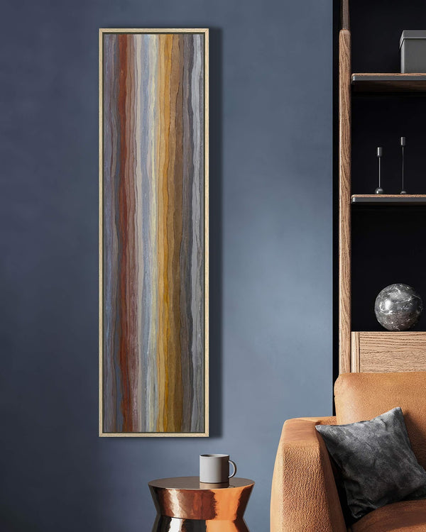 Vertical canvas wall art in interior setting.