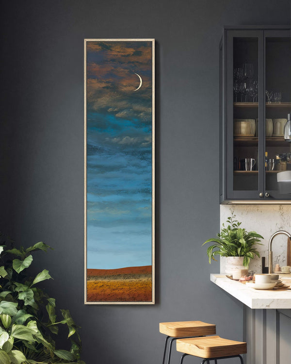 Vertical canvas wall art in interior setting.