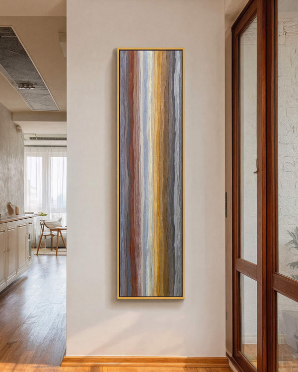 Vertical canvas wall art in interior setting.
