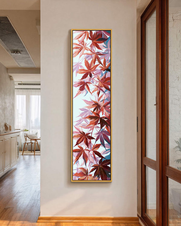 Vertical canvas wall art in interior setting.