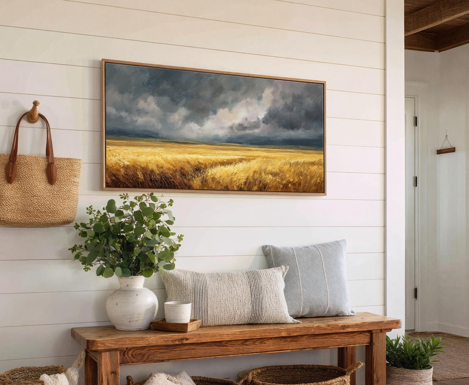 This horizontal canvas print features an impressionistic landscape of a golden field under a dramatic, cloudy sky, rendered in a palette of warm yellows and cool grays. It is displayed.