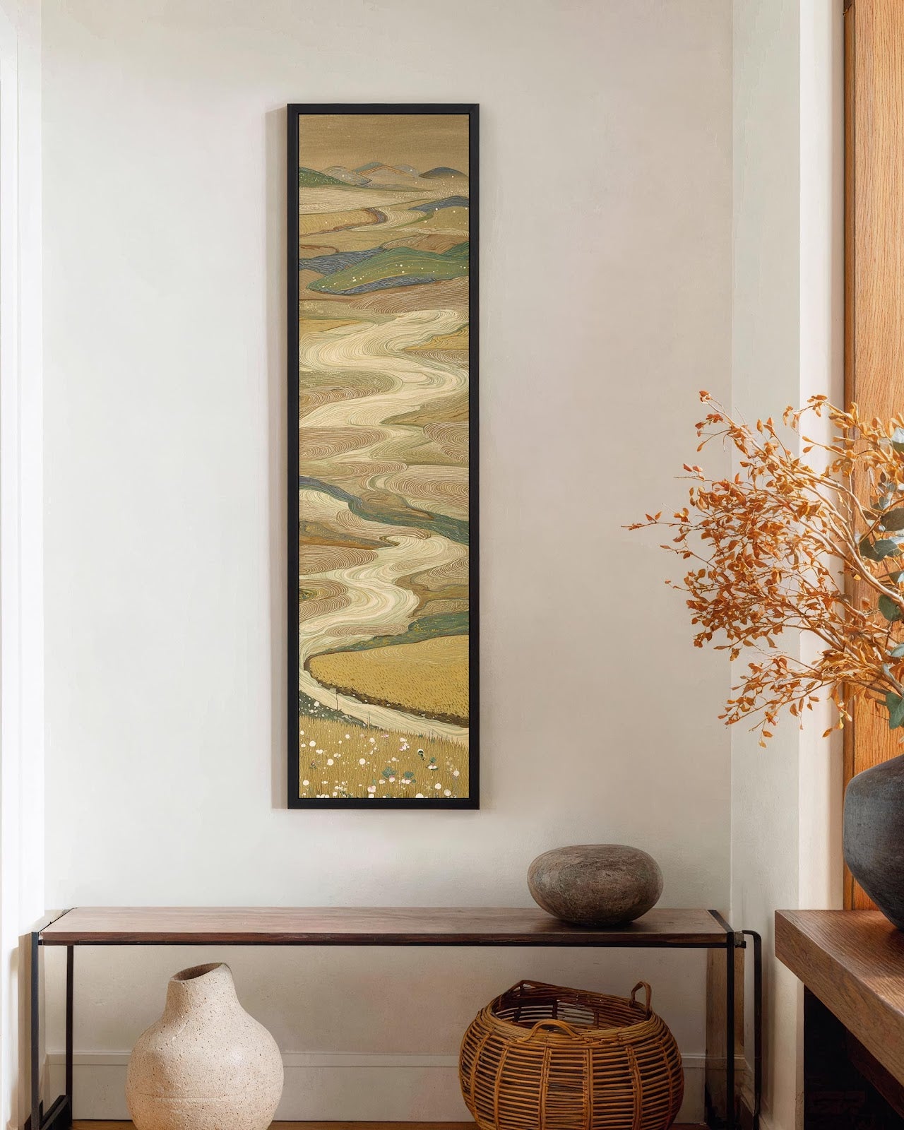 Vertical canvas wall art in interior setting.