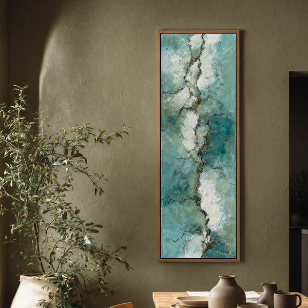Vertical canvas wall art in interior setting.