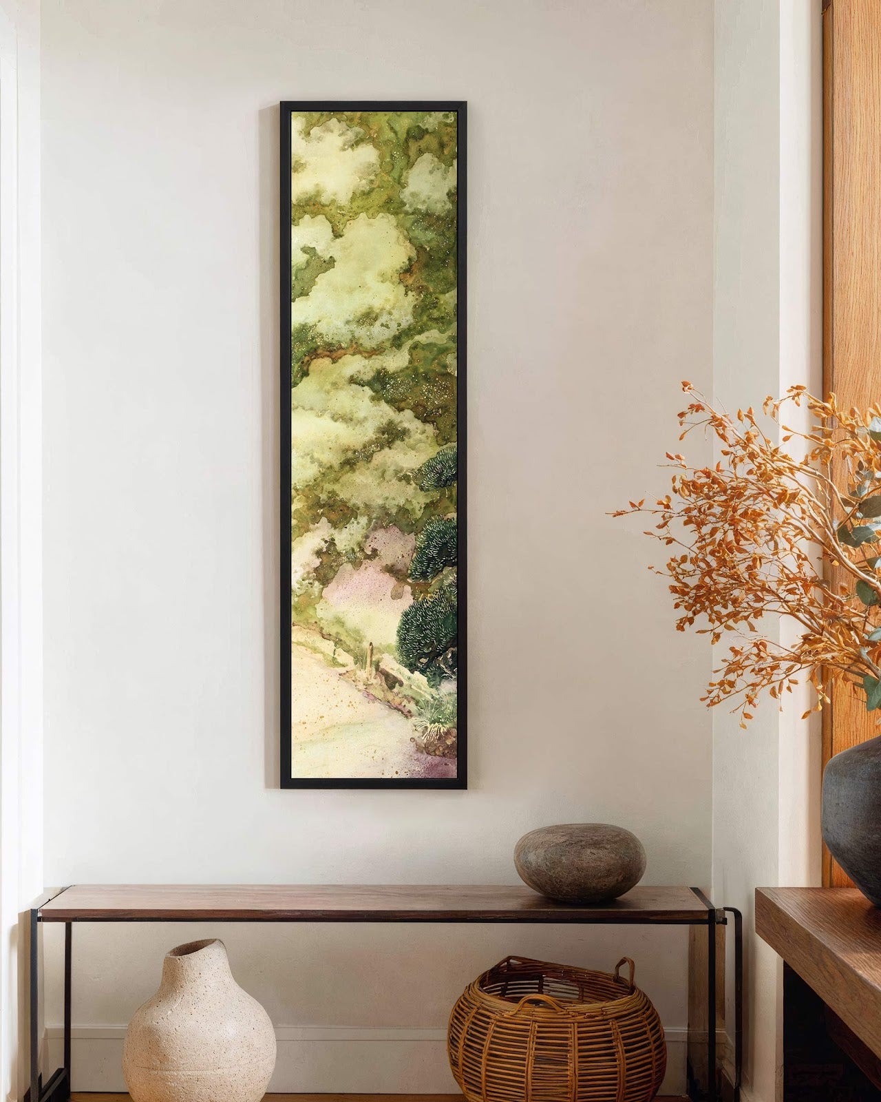 Vertical canvas wall art in interior setting.
