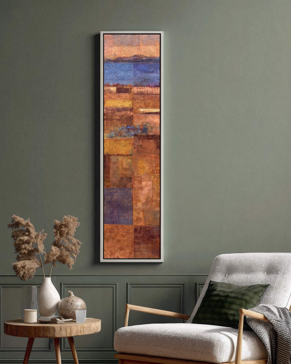 Vertical canvas wall art in interior setting.