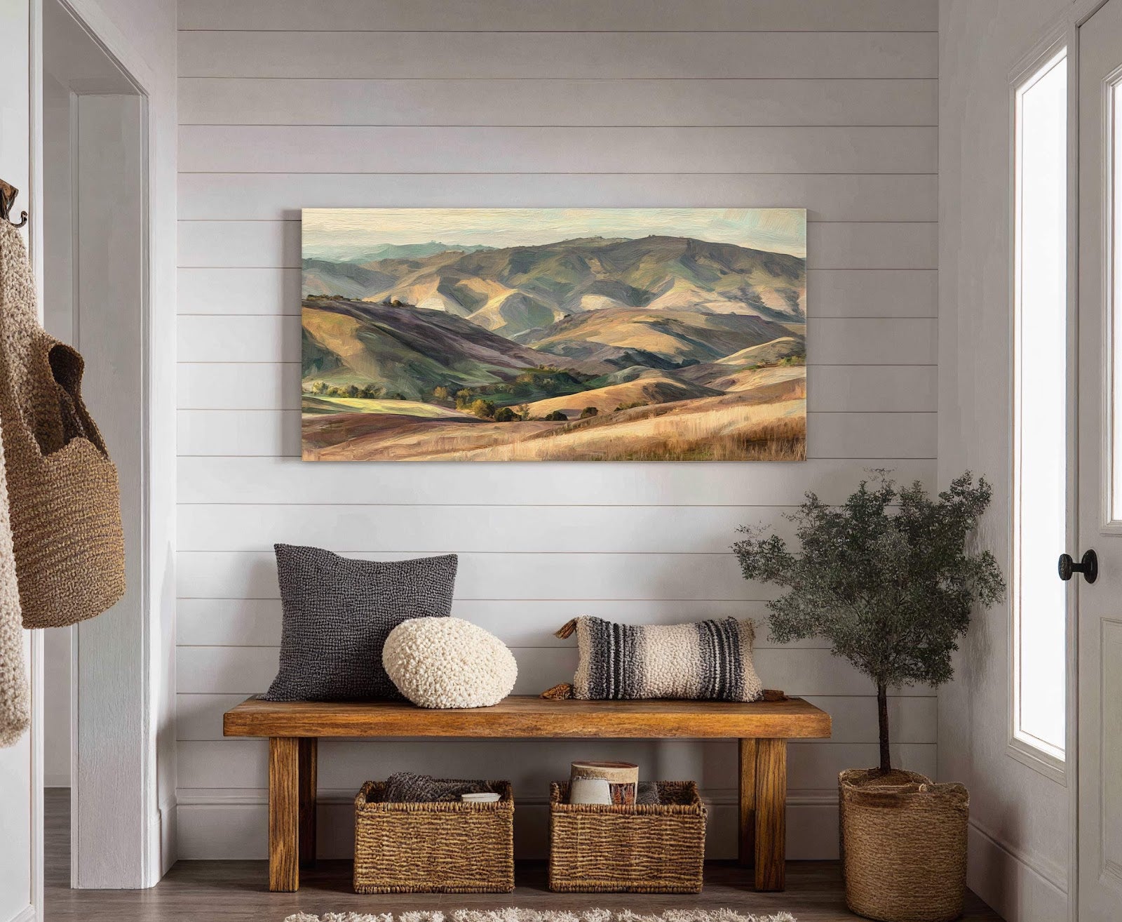 This horizontal canvas wall art print features an impressionistic landscape with rolling hills in earthy tones of green, brown, and yellow. It is displayed on a white paneled wall in.