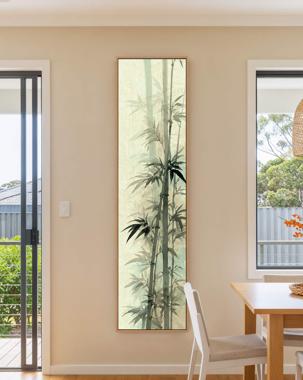 Vertical canvas wall art in interior setting.