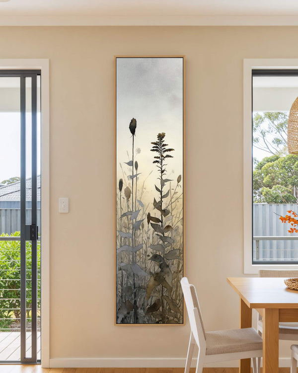 Vertical canvas wall art in interior setting.