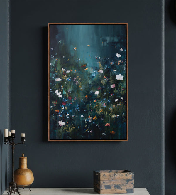 Pecan framed abstract painting featuring a lush, dark floral scene with varied wildflowers in white, pink, blue, and yellow, against a deep, moody teal and dark green background, hung on a charcoal wall