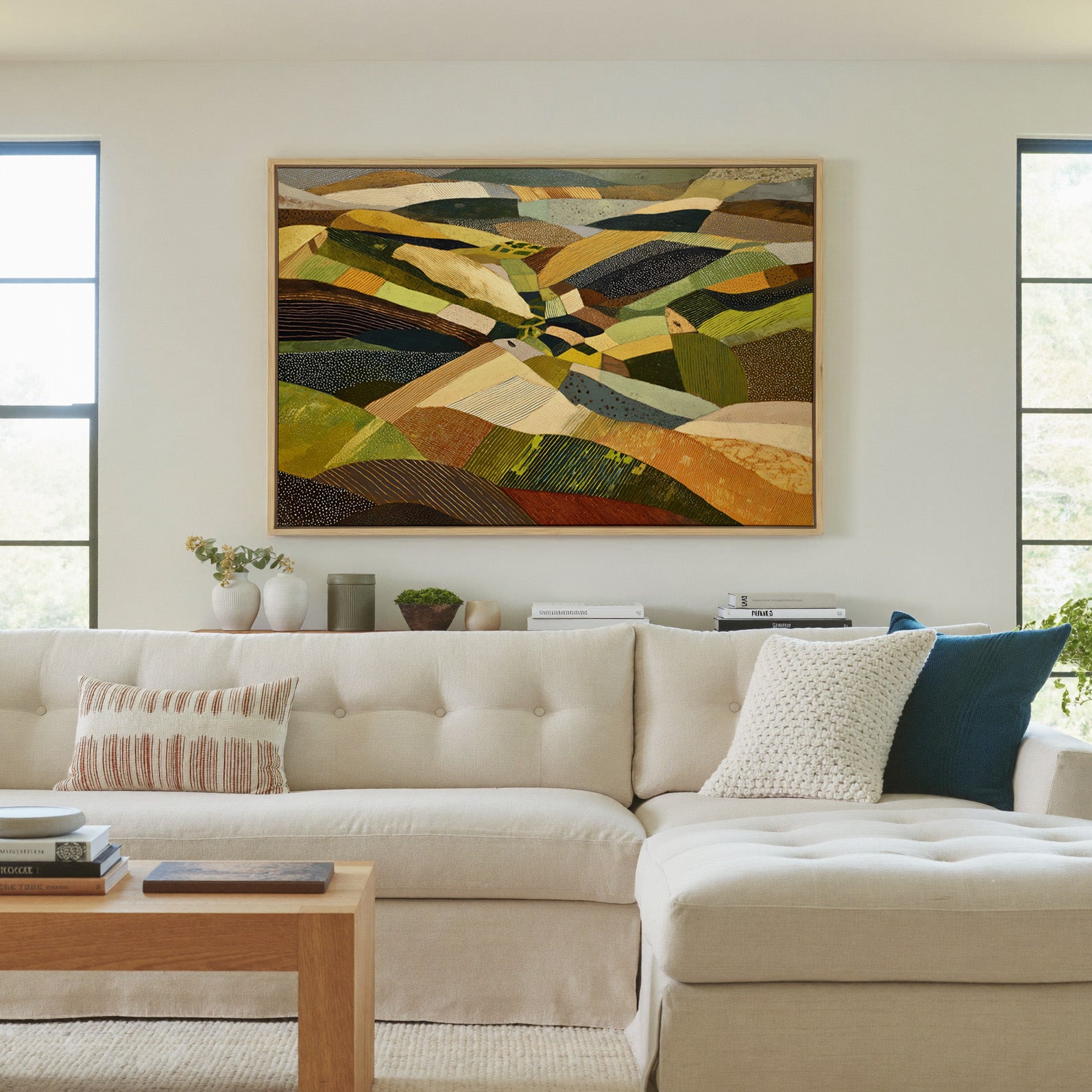 rolling abstract aerial landscape in olive, canvas wall art in a natural wood frame in a living room