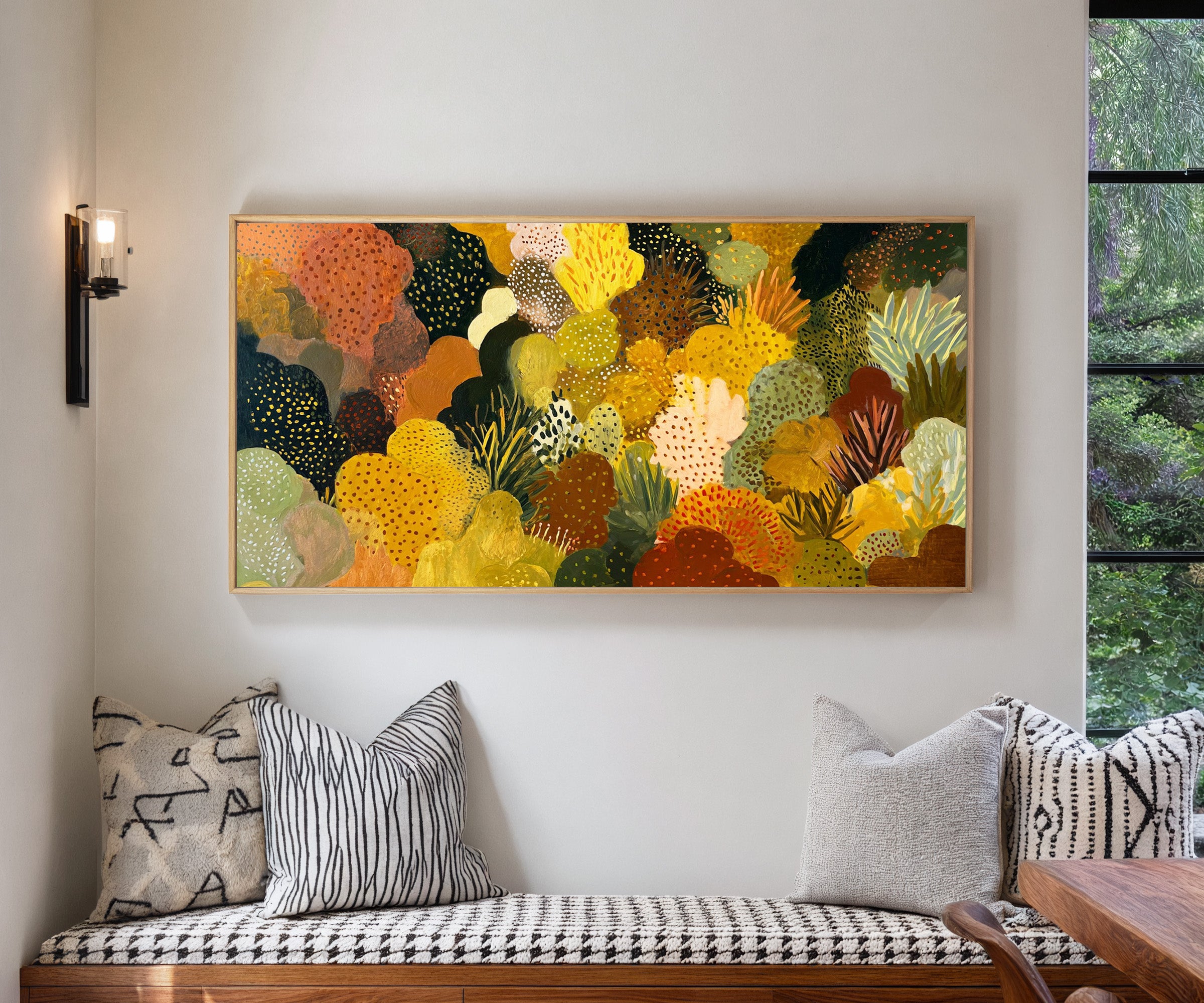 dense ochre and terracotta abstract canvas wall art in a natural wood frame in a living room