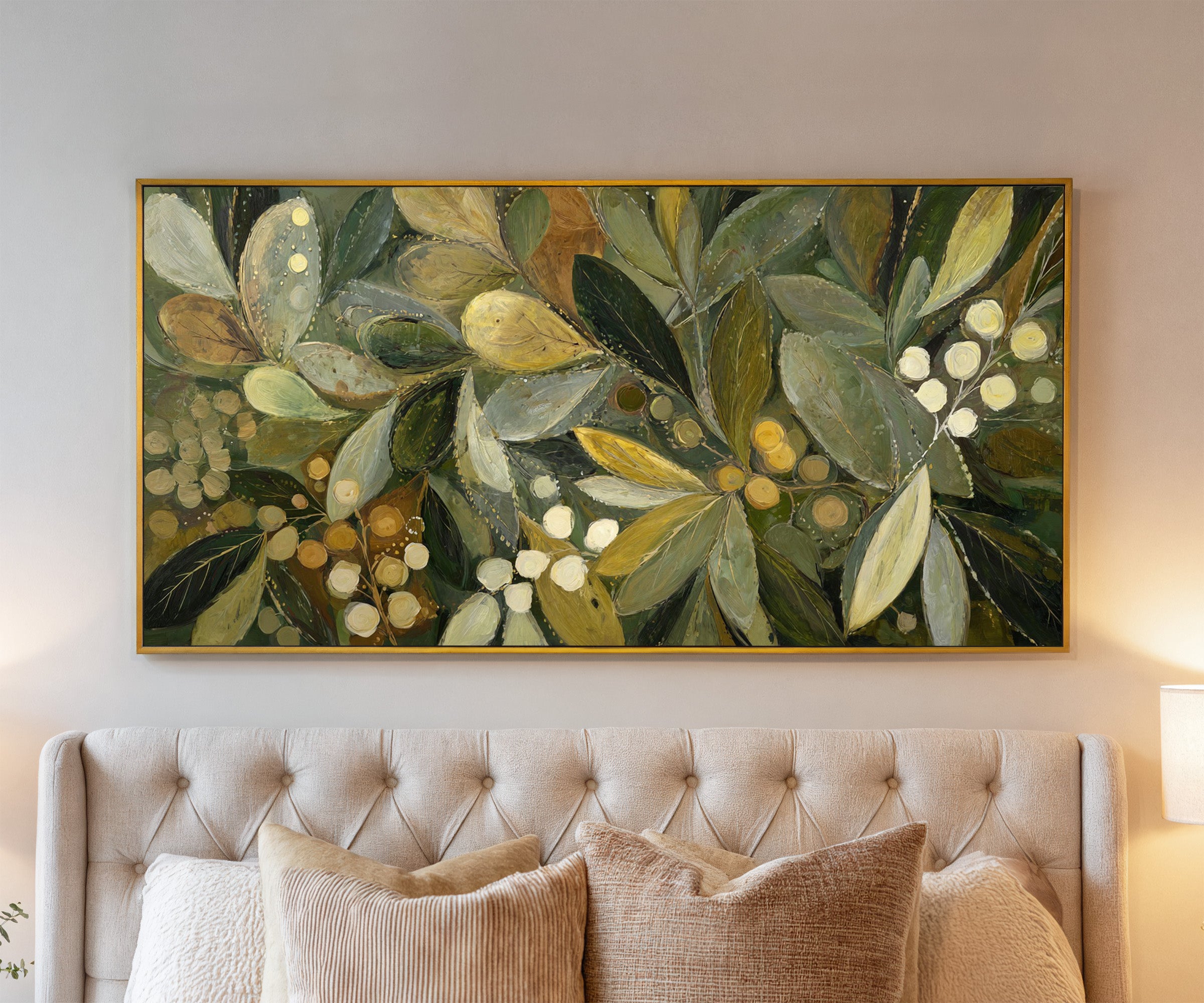 layered olive leaves with pale berries canvas wall art in a gold frame above a bed