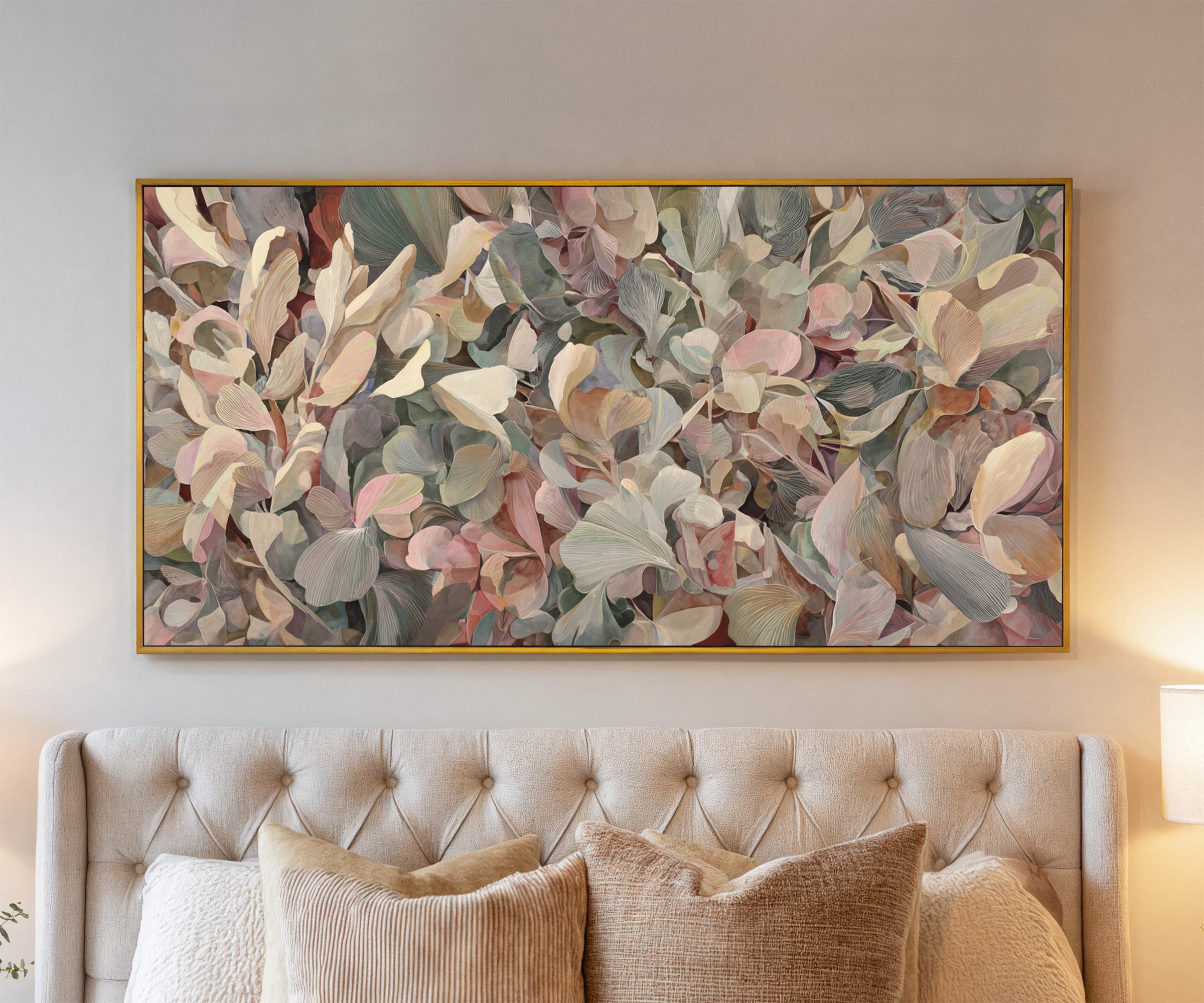 dense rounded petals in blush, cream, sage, and canvas wall art in a gold frame above a bed