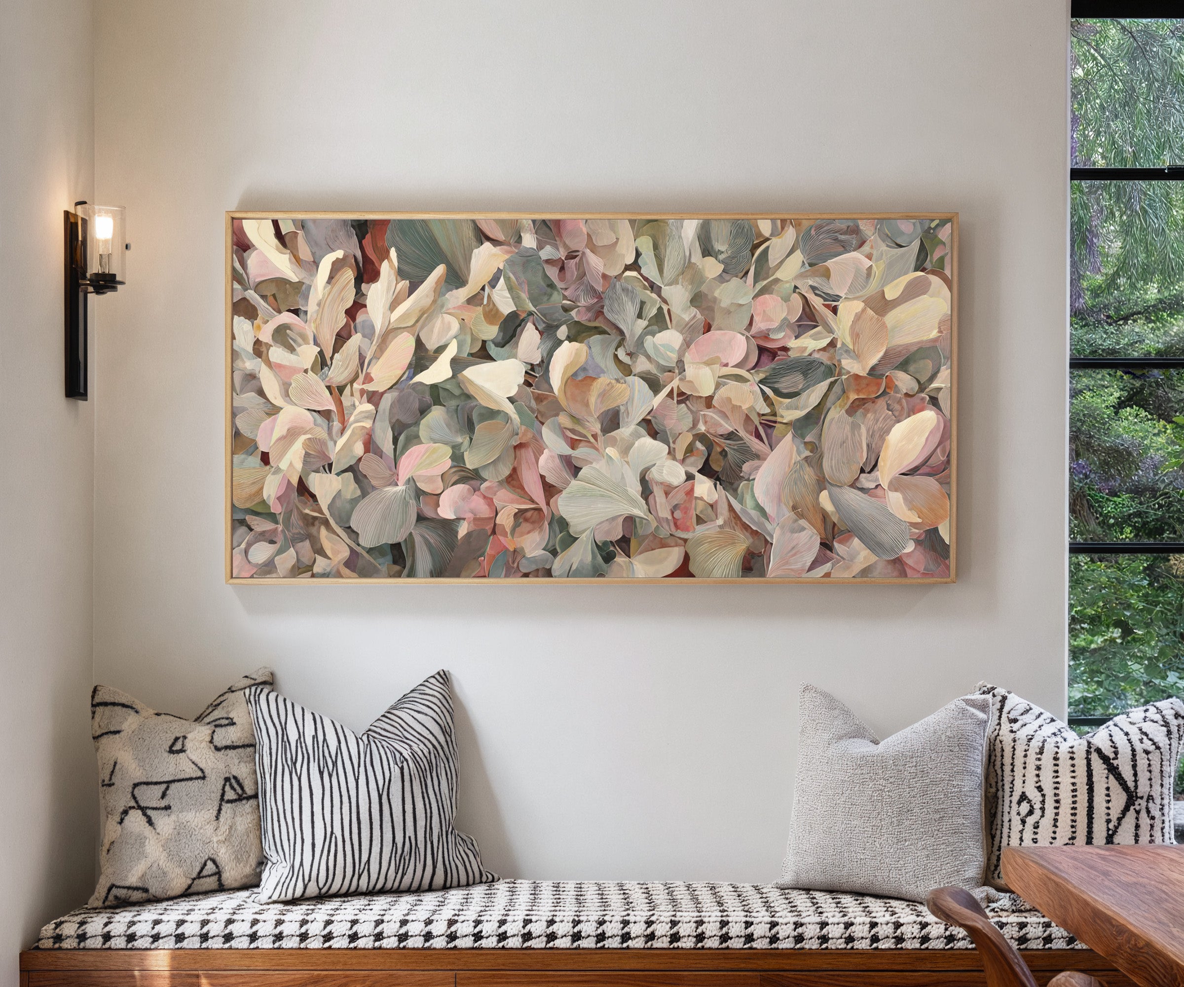 dense rounded petals in blush, cream, sage, and canvas wall art in a natural wood frame in a living room