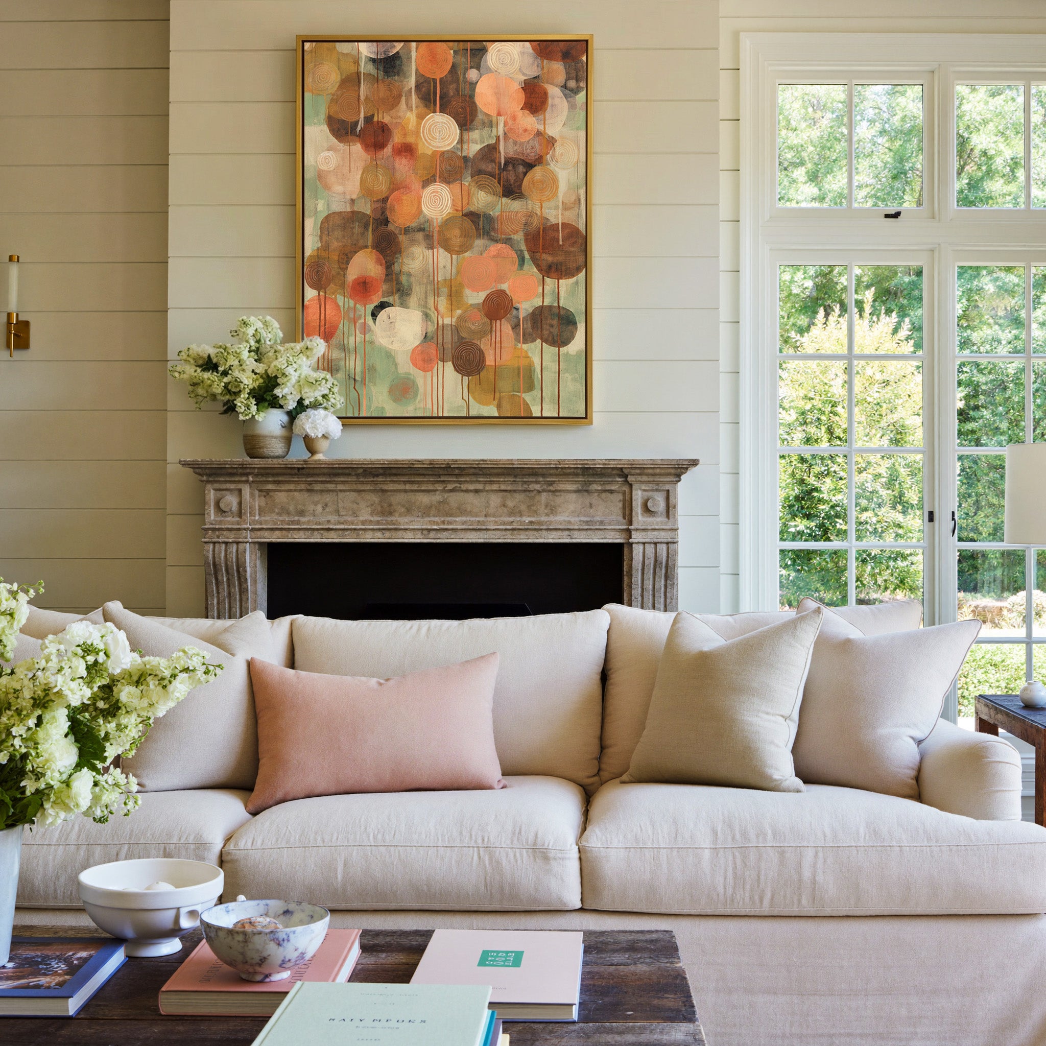 soft green and warm earth abstract with canvas wall art in a gold frame above a mantel