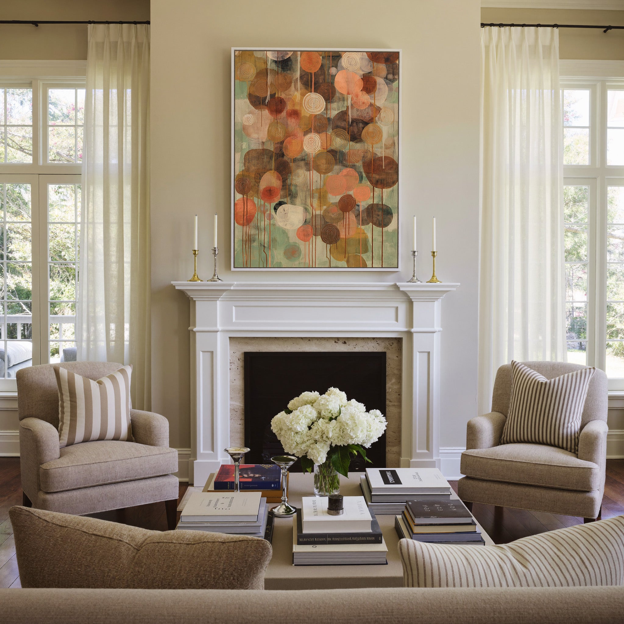 soft green and warm earth abstract with canvas wall art in a white frame above a mantel