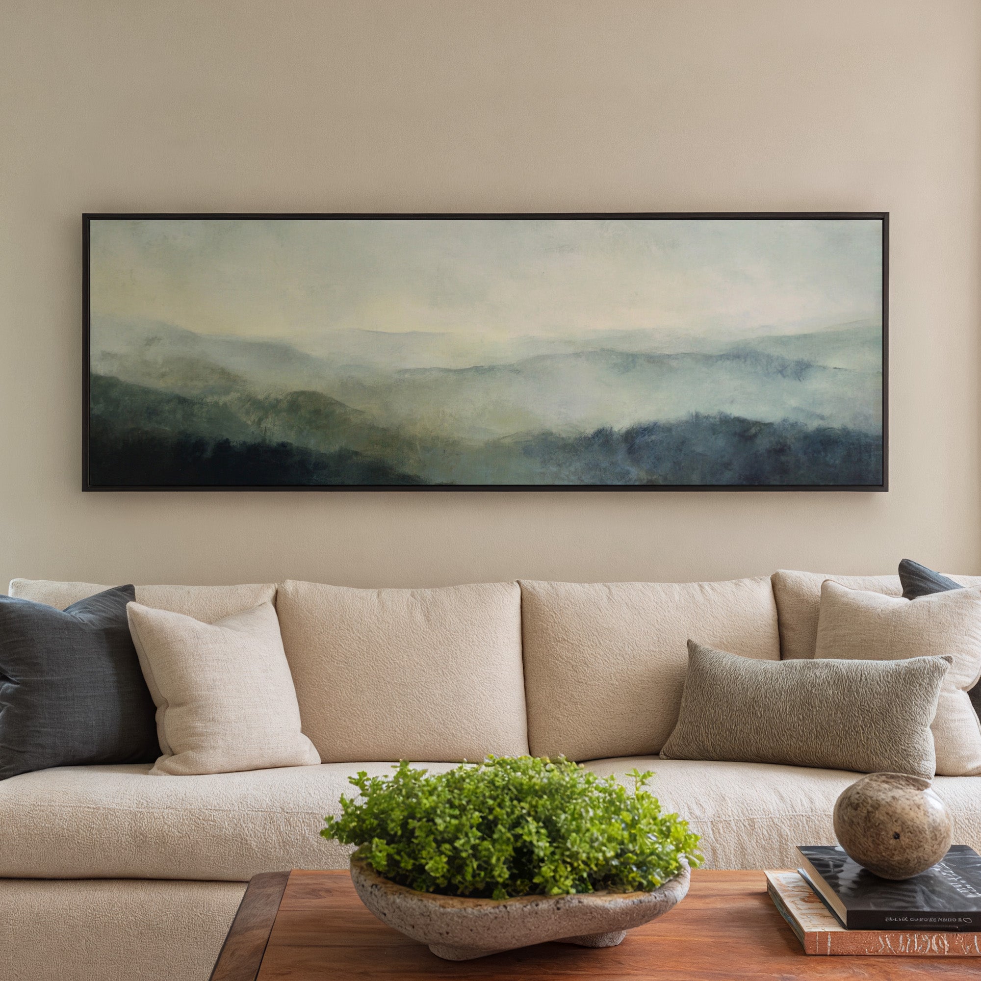 misty mountain ridges at dawn canvas wall art in a black frame in a styled room setting