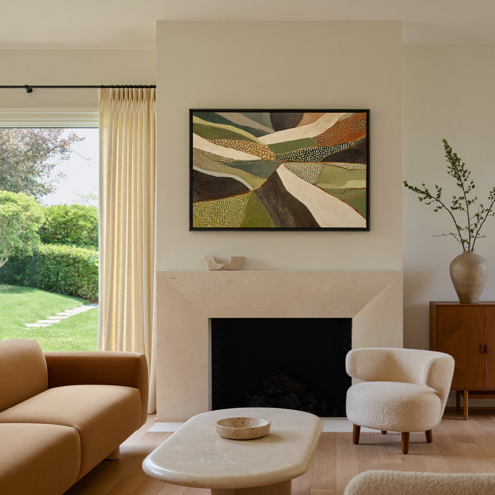 layered olive, cream, and brown abstract with canvas wall art in a black frame above a mantel