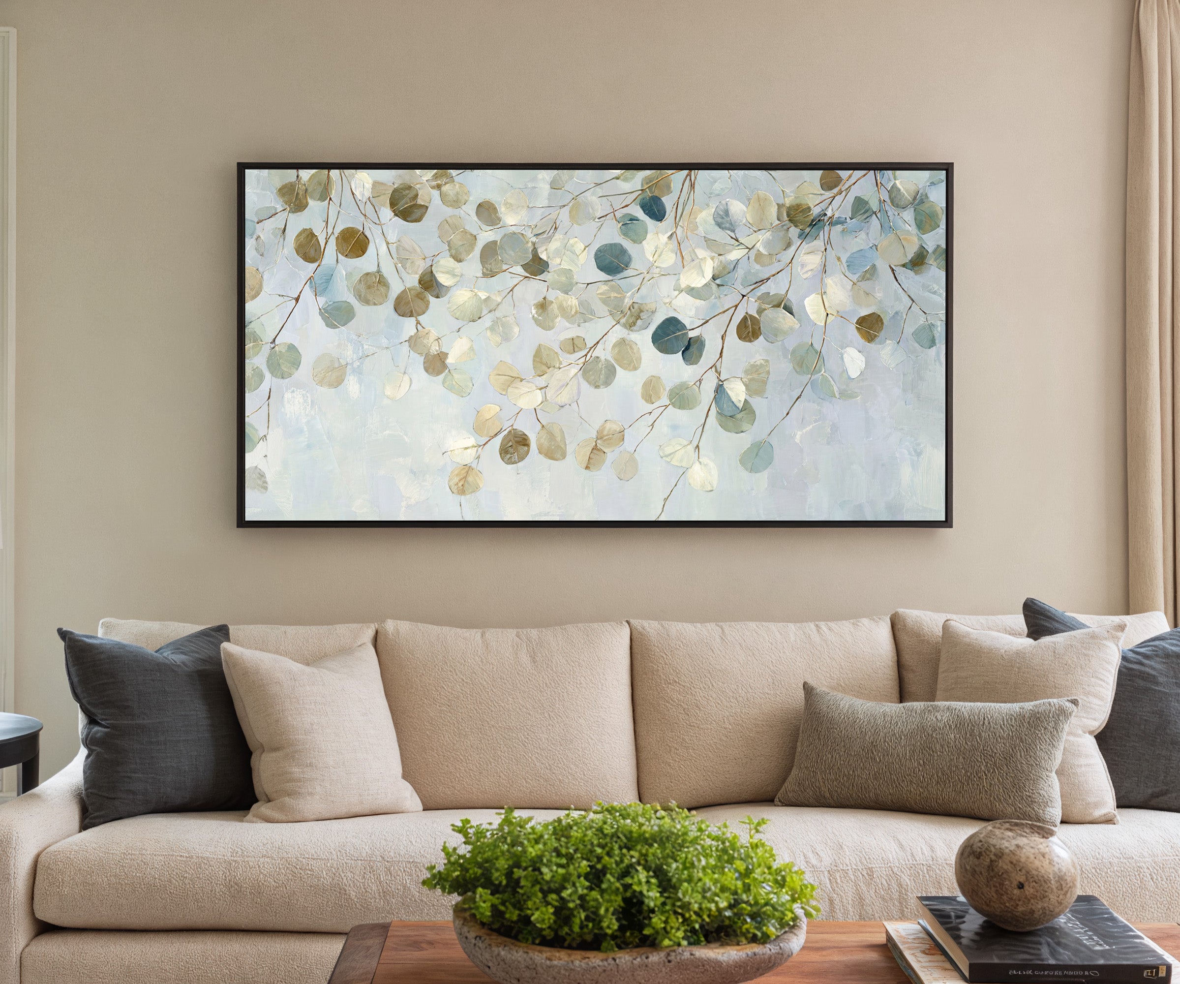 pale eucalyptus leaves on thin branching stems canvas wall art in a black frame in a styled room setting